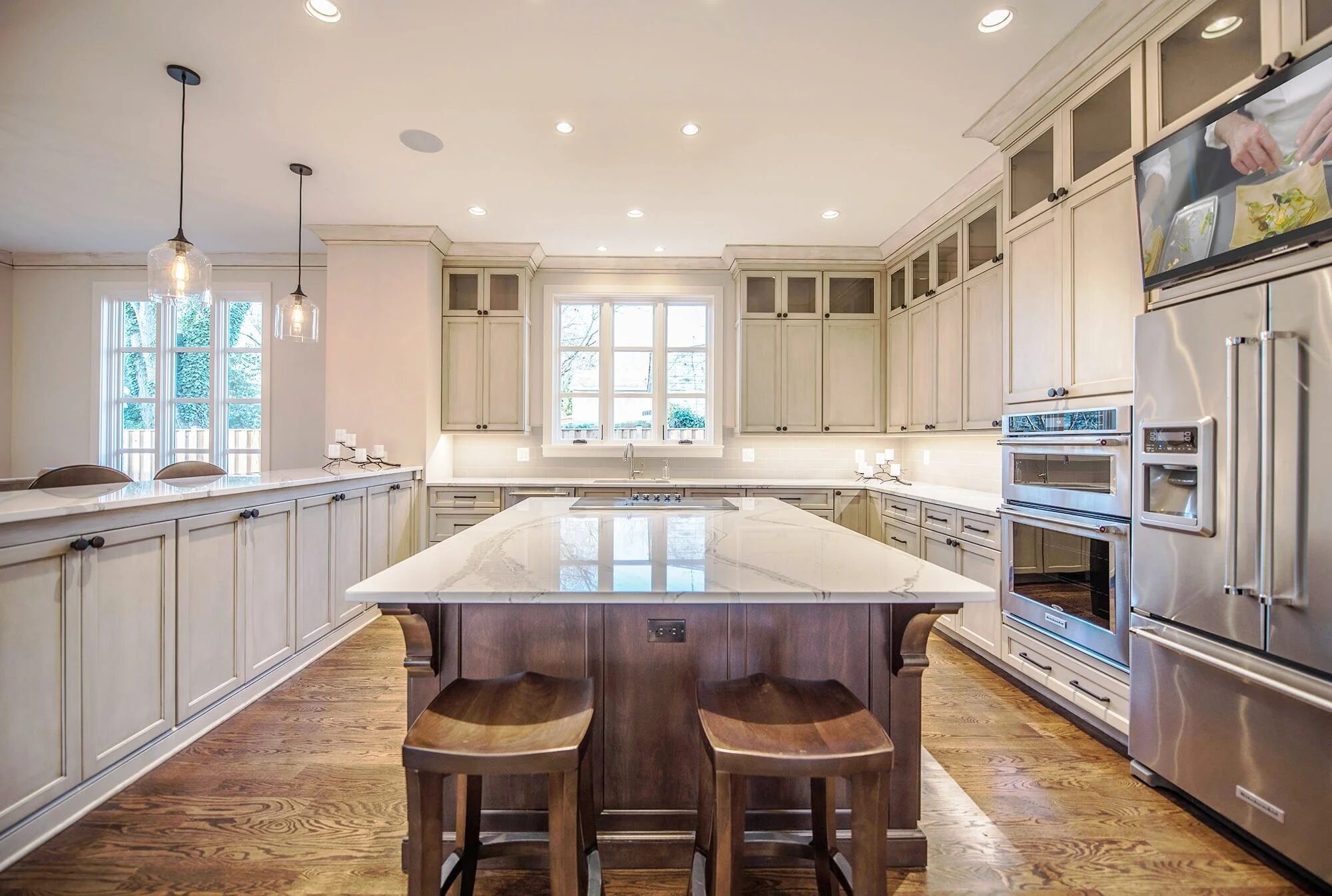Kitchen with in-cabinet display and integrated lighting