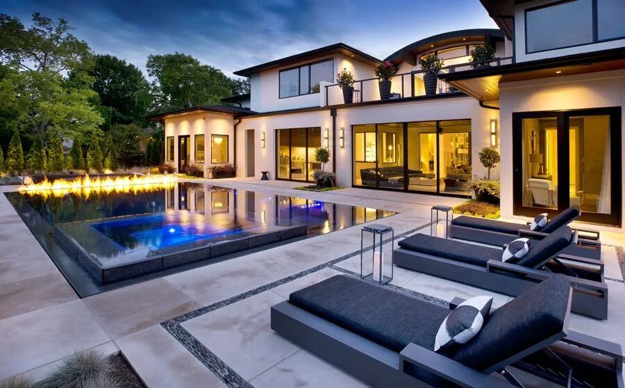 The house at dusk seen from the pool deck