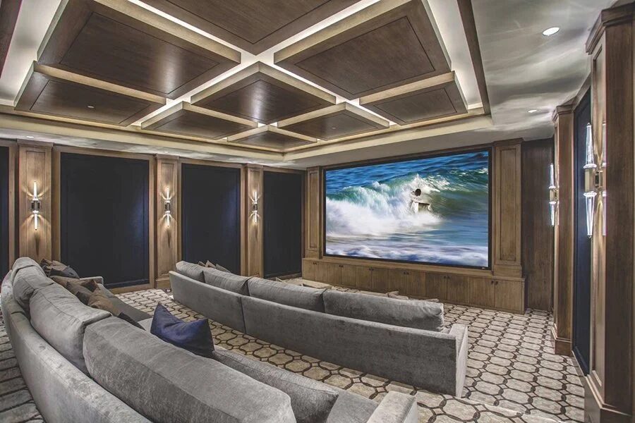 Custom home theater with coffered ceiling and tiered seating